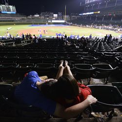 Fans sleeping in the box seats at about 12:40 a.m.