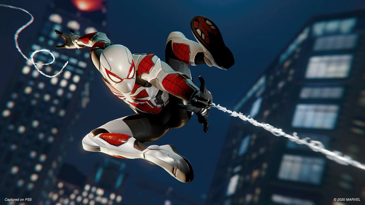 Peter Parker in the white, black, and red Advanced Armored suit in Marvel’s Spider-Man Remastered. 