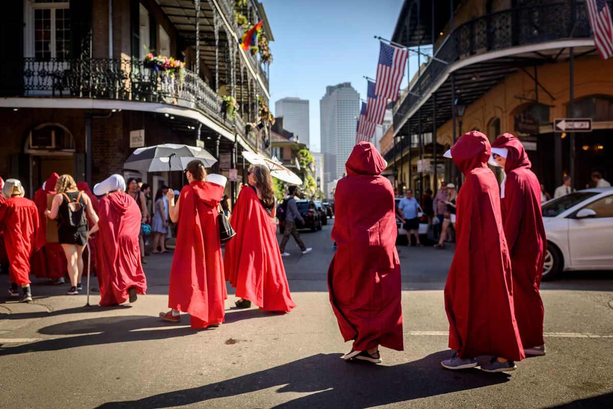 Protesters dressed as characters from “The Handmaid’s Tale” march through the French Quarter of New Orleans, Louisiana, on May 25, 2019, demonstrating against a bill that would ban abortion as early as six weeks into pregnancy.