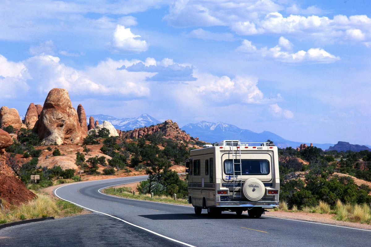 An RV drives through Arches National Park in Moab.