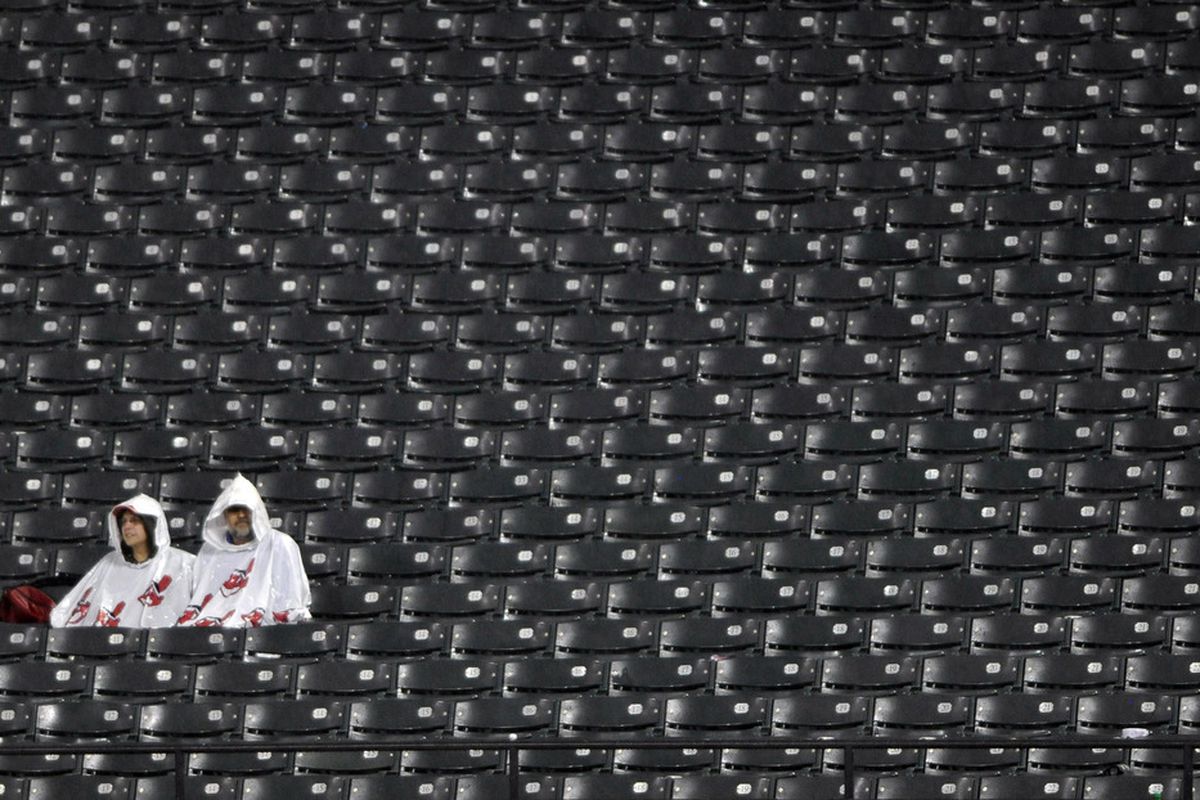 May 7, 2012; Cleveland, OH, USA; Fans sit in the outfield seats during a rain delay in the eighth inning of a game between the Chicago White Sox and the Cleveland Indians at Progressive Field. Mandatory Credit: David Richard-US PRESSWIRE