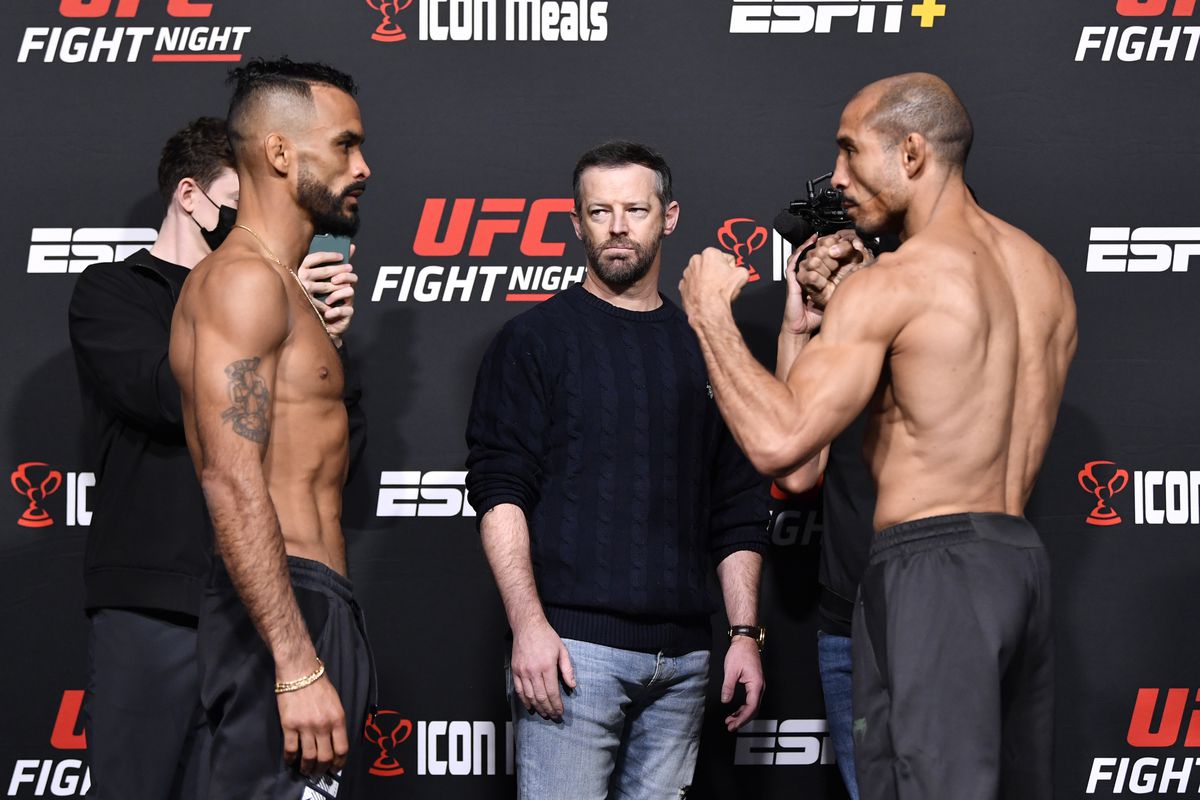 Opponents Rob Font and Jose Aldo of Brazil face off during the UFC Fight Night weigh-in at UFC APEX on December 03, 2021 in Las Vegas, Nevada.