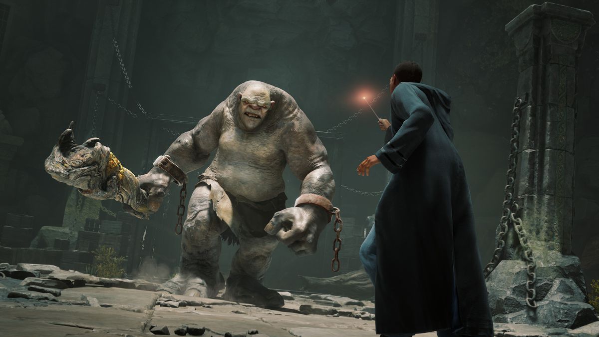 An image of a wizard in Hogwarts Legacy fighting a troll. 