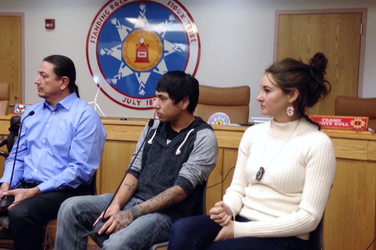 Standing Rock Sioux Chairman Dave Archambault, left, tribal youth Garrett Hairychin and actress Shailene Woodley, right, look on as several celebrities met with tribal officials and youth in Fort Yates, N.D. to discuss efforts to halt construction of the 