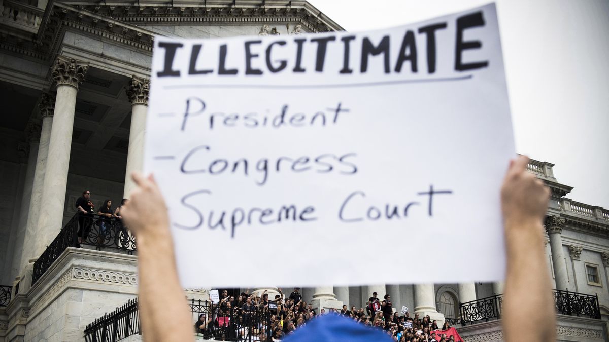 A demonstrator protests the appointment of Supreme Court nominee Brett Kavanaugh in front of the US Capitol, on October 6, 2018.
