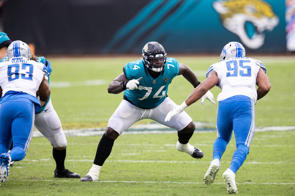 Cam Robinson #74 of the Jacksonville Jaguars blocks against Romeo Okwara #95 of the Detroit Lions during the fourth quarter of a game at TIAA Bank Field on October 18, 2020 in Jacksonville, Florida.