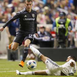 Real Salt Lake forward Brooks Lennon (12) avoids an opponent during Real Salt Lake's 3-0 victory against the Colorado Rapids at Rio Tinto Stadium on Saturday, April 21, 2018, in Sandy.