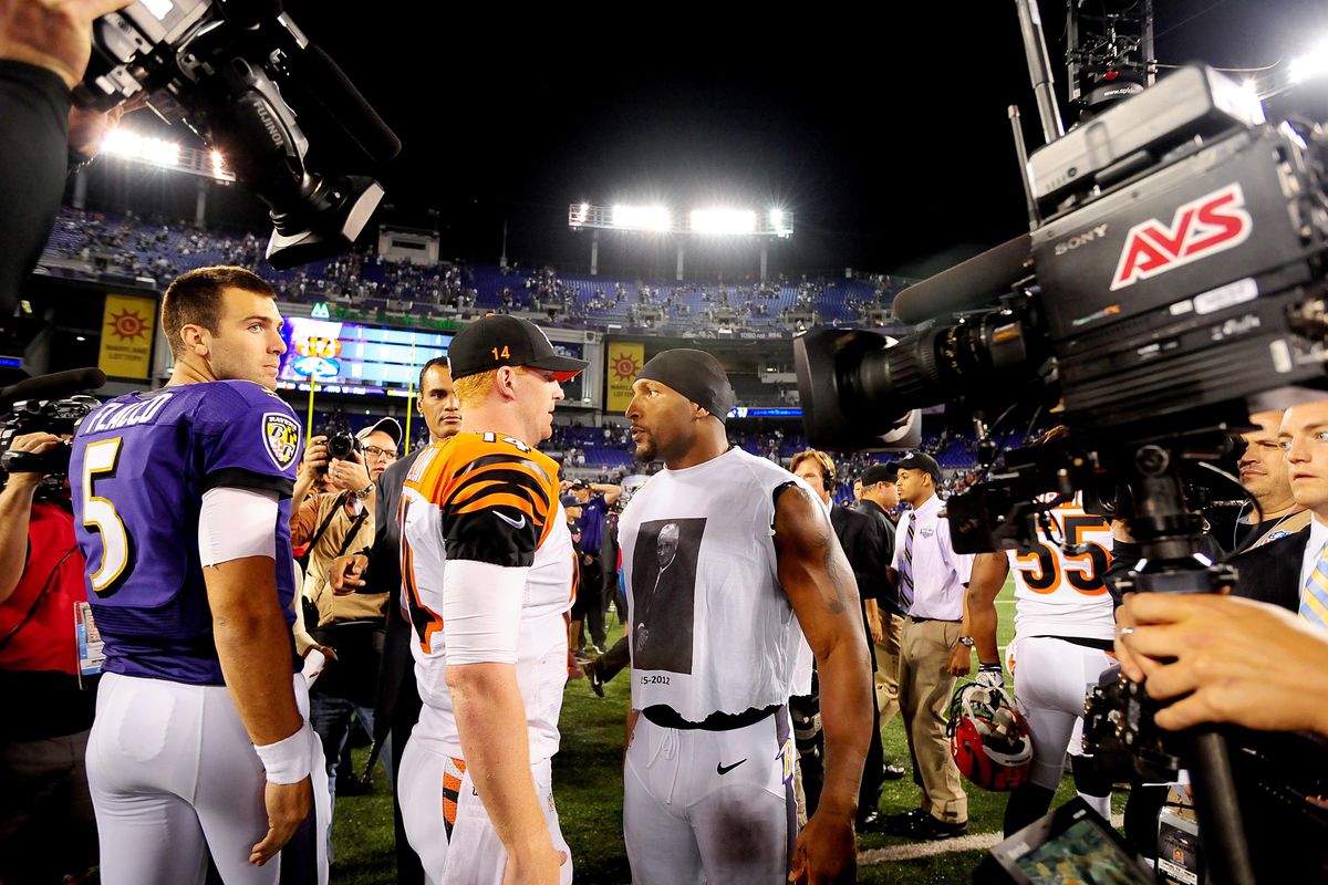 September 10, 2012; Baltimore, MD, USA; Baltimore Ravens linebacker Ray Lewis (right) talks to Cincinnati Bengals quarterback Andy Dalton (14) after the game at M&T Bank Stadium. Mandatory Credit: Evan Habeeb-US PRESSWIRE