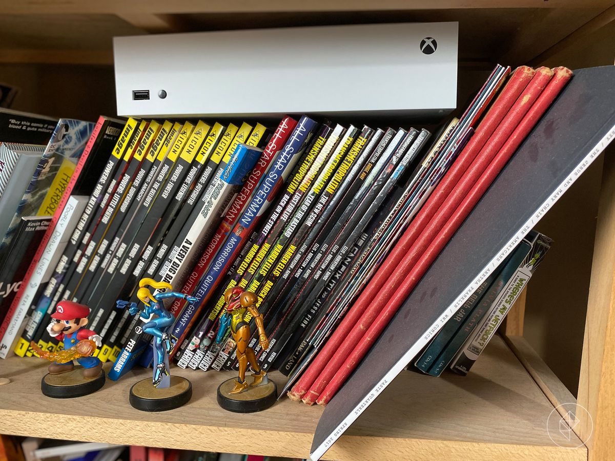 Photo of Xbox-S console on top of books
