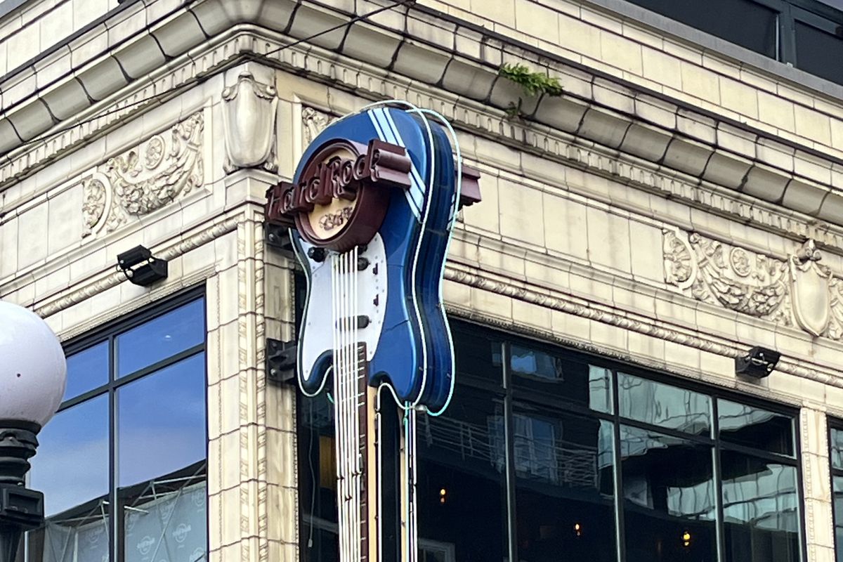 A guitar-shaped Hard Rock Cafe sign.