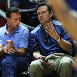 Utah Jazz head coach Quin Snyder and Jazz general manager Dennis Lindsey talk as the Utah Jazz and the Philadelphia 76ers play in Summer League action in the Huntsman Center at the University of Utah in Salt Lake City on Wednesday, July 5, 2017.