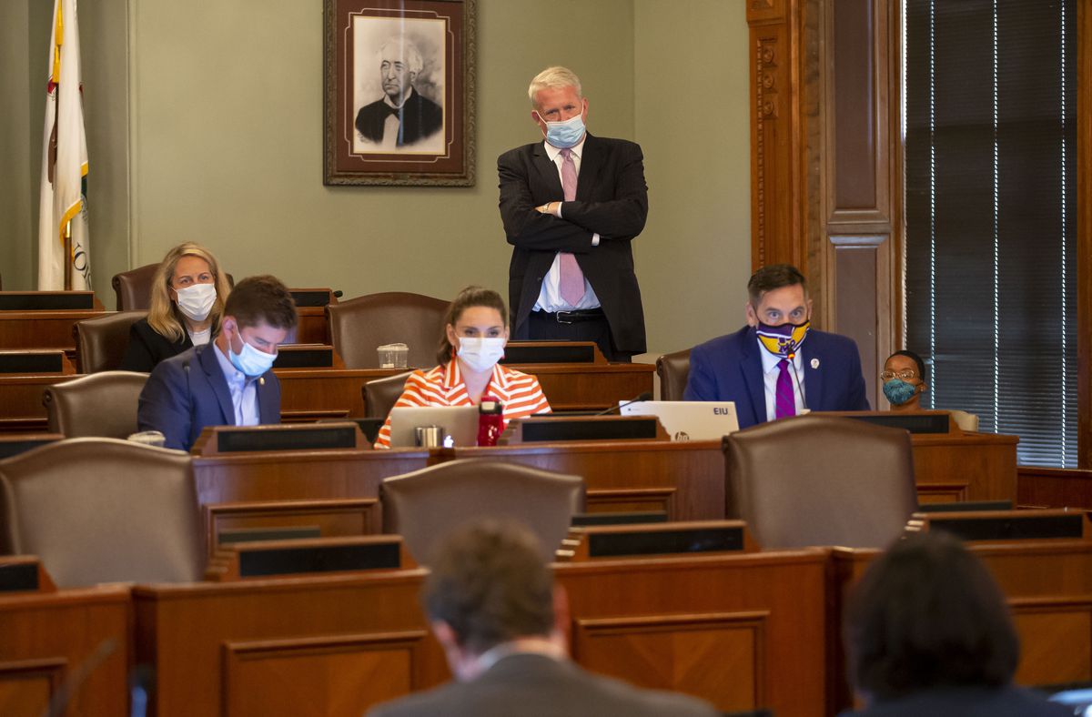 Illinois House Republican Leader Jim Durkin, standing, watches as state Rep. Tim Butler, right, R-Springfield, asks questions during an Illinois House of Representatives Redistricting Committee meeting Tuesday.
