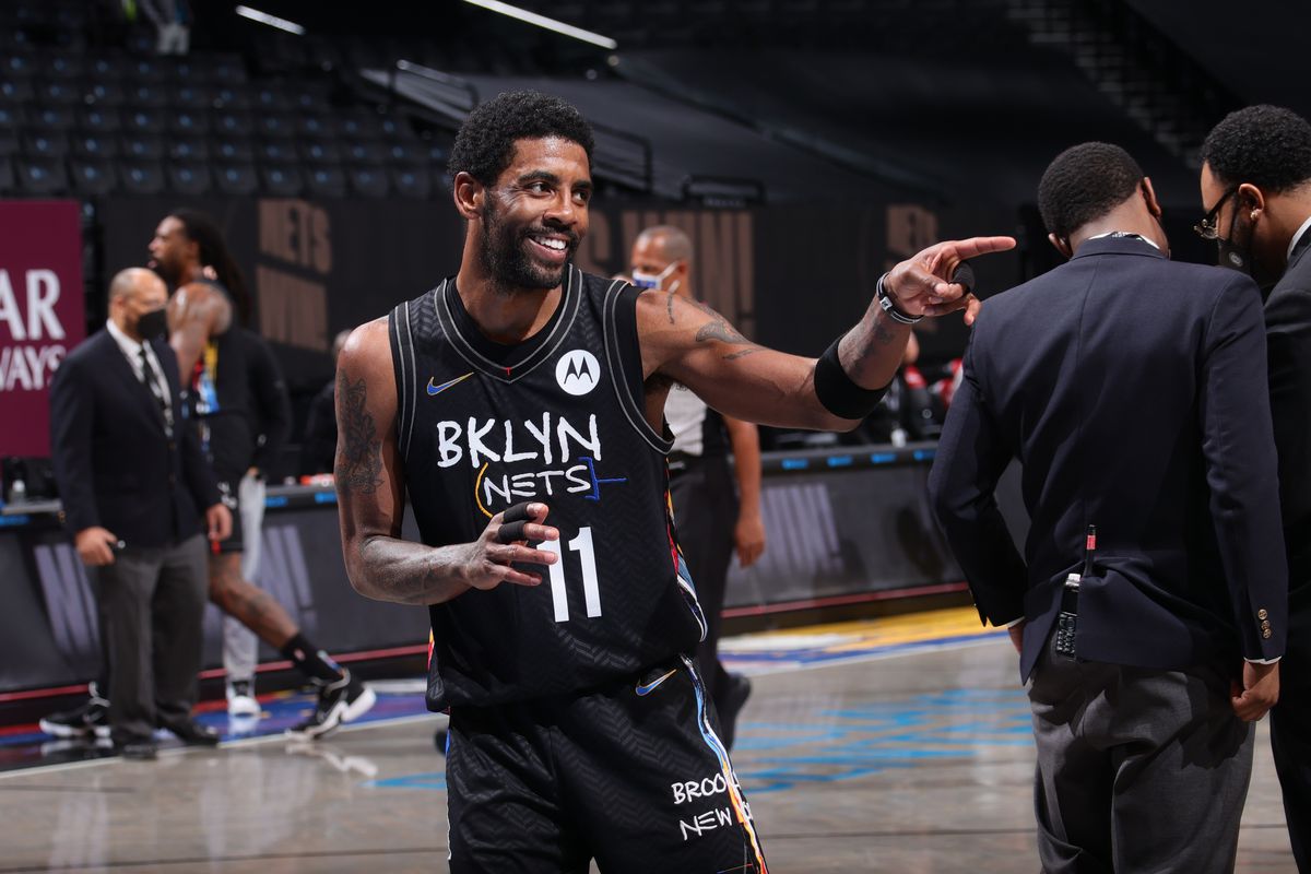 Kyrie Irving of the Brooklyn Nets smiles after the game against the Sacramento Kings on February 23, 2021 at Barclays Center in Brooklyn, New York.