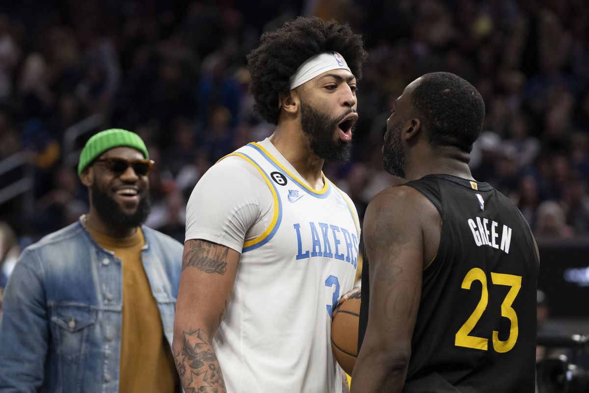 Anthony Davis and Draymond Green arguing while LeBron James laughs in the background