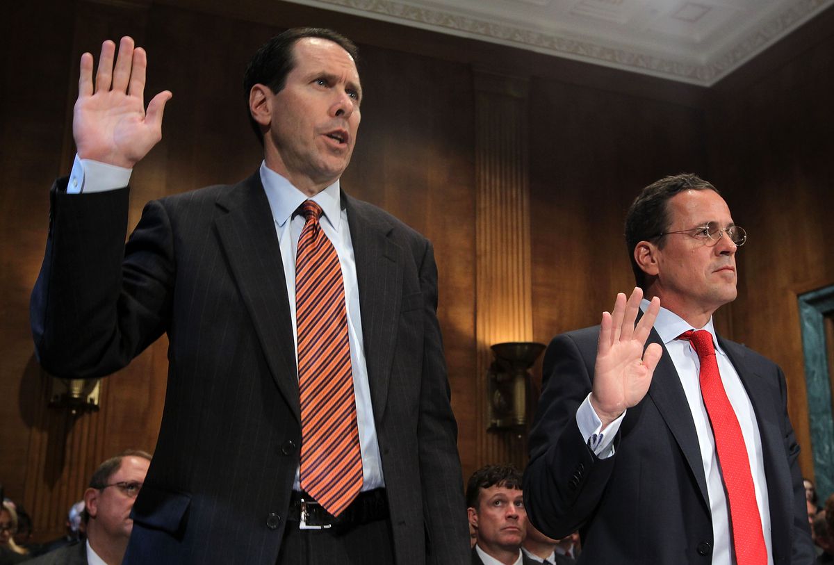AT&T CEO Randall Stephenson (L) and T-Mobile USA CEO Philipp Humm are sworn in during a May 2011 Senate hearing on the merger.