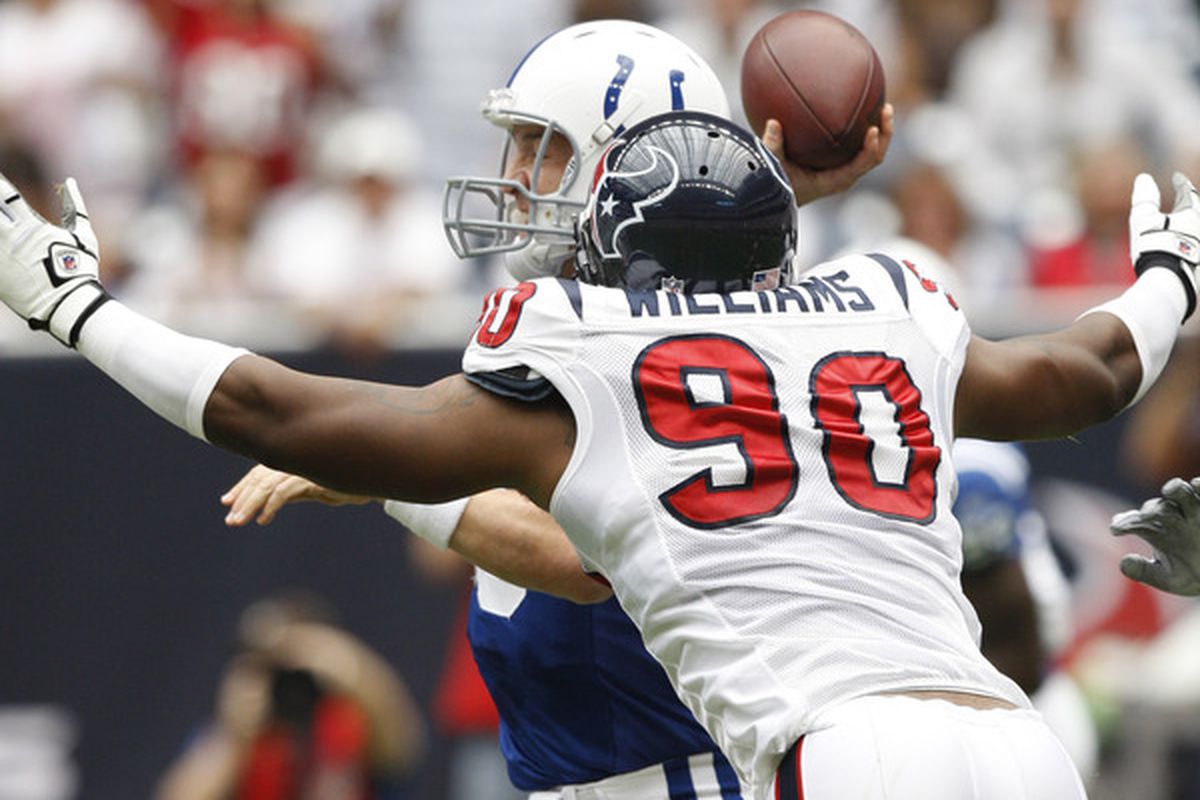HOUSTON - SEPTEMBER 12:  Defensive end Mario Williams #90 of the Houston Texans applies pressure to quarterback Peyton Manning #18 f the Indianapolis Colts at Reliant Stadium on September 12 2010 in Houston Texas.  (Photo by Bob Levey/Getty Images)