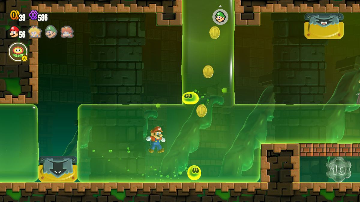 Mario swims through slime, flanked by Wubbas, in a screenshot from Super Mario Bros. Wonder
