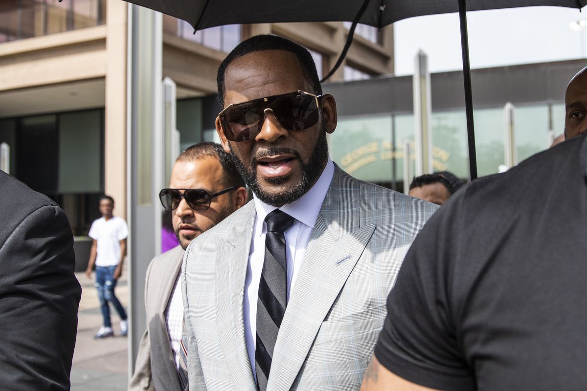 R. Kelly walks with supporters out of the Leighton Criminal Courthouse, Thursday morning, June 6, 2019. 
