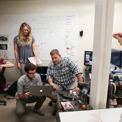 Members of the tech and marketing teams Yenn Lei, Madeleine Flynn, Nate Hardyman and Jed Ashford, left to right, discuss the design for a new web feature with Jeffrey Harmon, co-founder and CMO, right, at VidAngel's office in Provo on Wednesday, July 20, 2016.