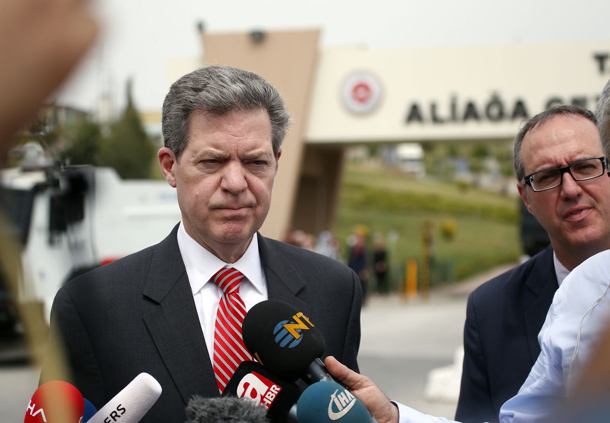 FILE - In this Monday, April 16, 2018, file photo, Sam Brownback, U.S. Ambassador-at-Large for International Religious Freedom, talks to members of the media outside the prison complex Aliaga, Izmir province, western Turkey, where jailed pastor Andrew Cra