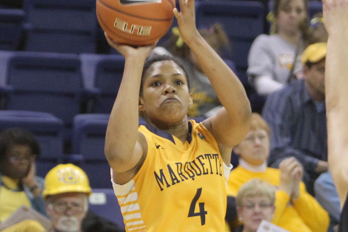 I'll be honest: I picked this photograph of Arlesia Morse because of the guy in the Marquette hard hat.