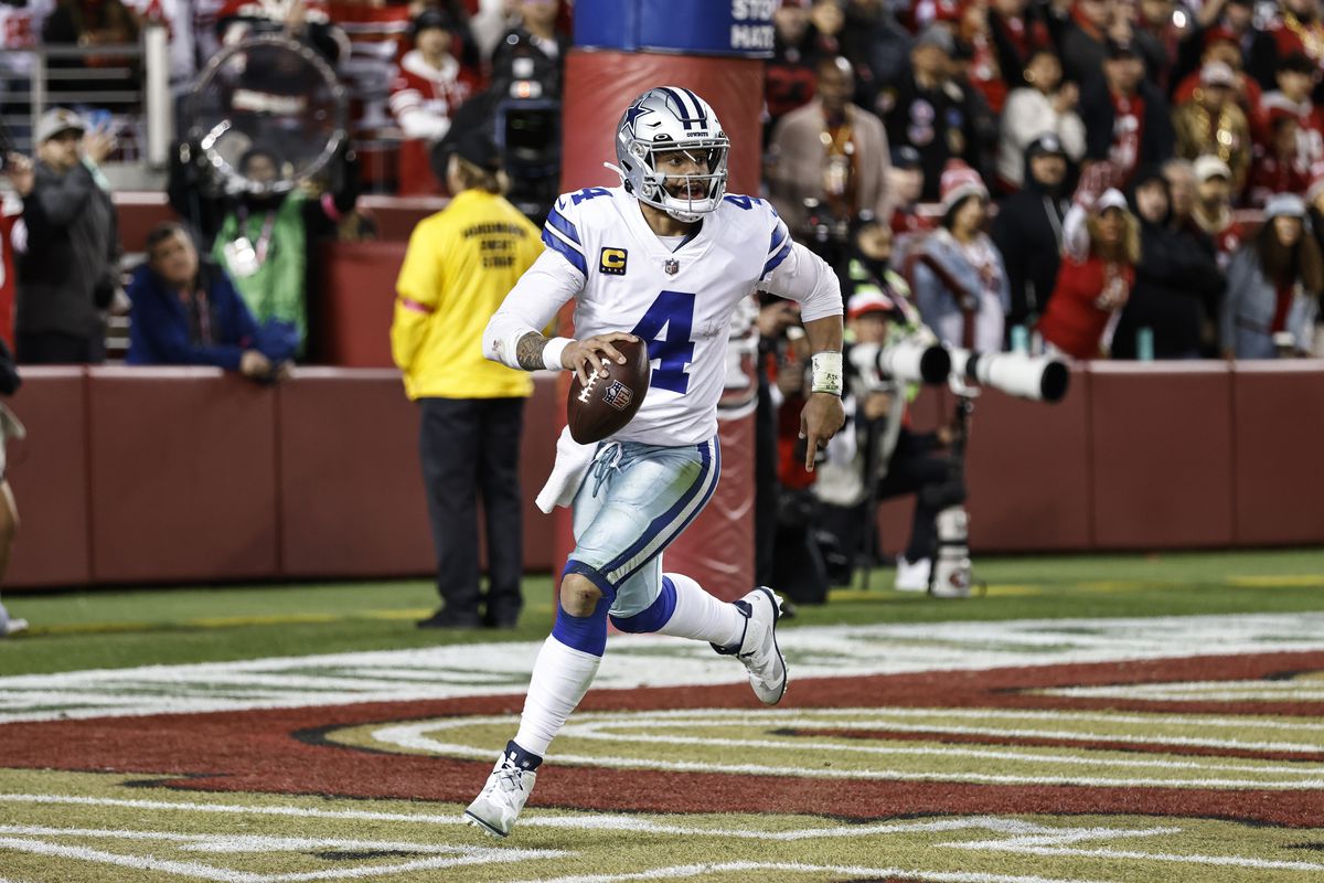 Dak Prescott #4 of the Dallas Cowboys scrambles and runs with the ball during an NFL divisional round playoff football game between the San Francisco 49ers and the Dallas Cowboys at Levi’s Stadium on January 22, 2023 in Santa Clara, California.