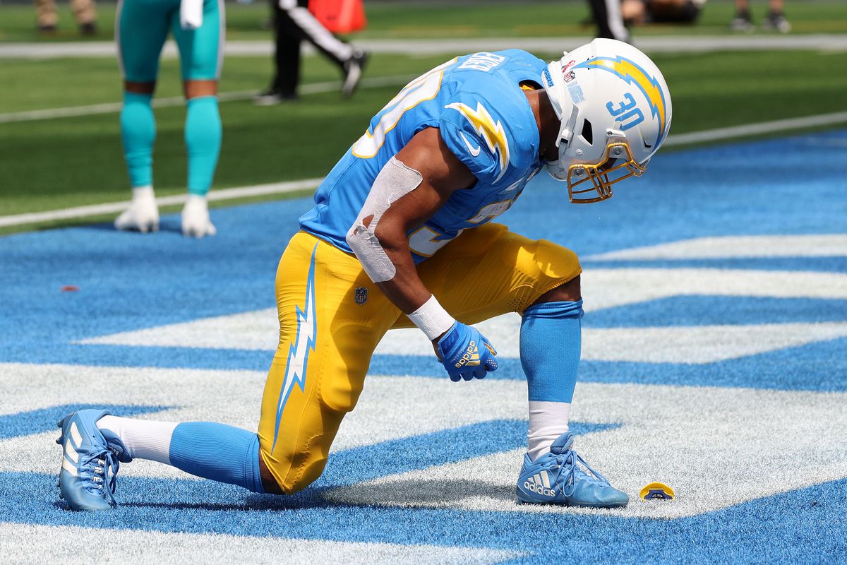 Sep 10, 2023; Inglewood, California, USA; Los Angeles Chargers running back Austin Ekeler (30) celebrates after scoring on a 1-yard touchdown run against the Miami Dolphins in the first half at SoFi Stadium. Mandatory Credit: Kirby Lee-USA TODAY Sports