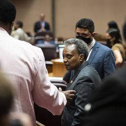 Mayor Lori Lightfoot speaks with Ald. Jason Ervin (28th) during a Chicago City Council meeting at City Hall, Wednesday morning, June 23, 2021.