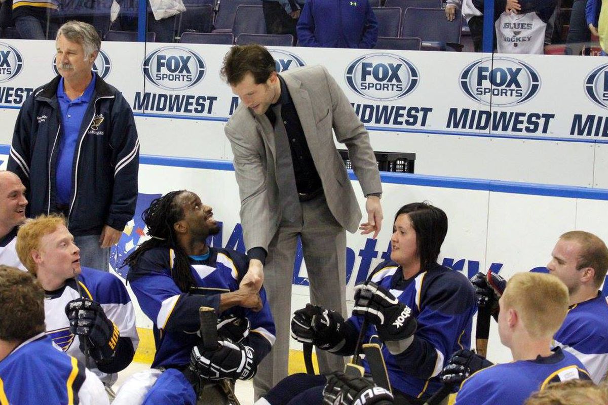 Blues captain David Backes greets athletes from the DASA Blues after a scrimmage at Scottrade Center