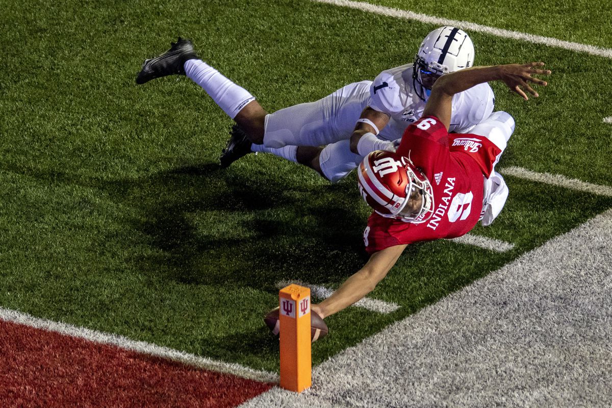 Indiana’s Michael Penix Extends the football to hit a two point conversion against Penn State.