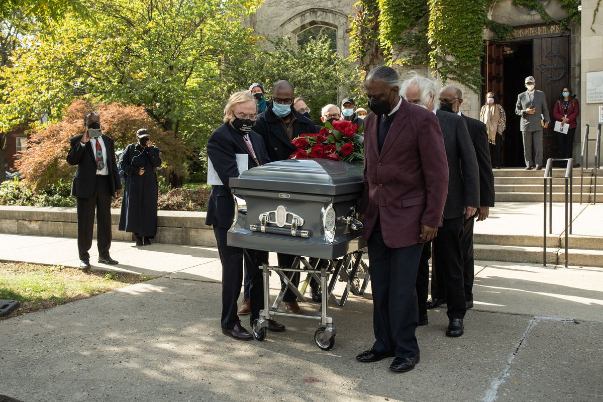 The casket of Timuel Black, a 102-year-old historian and activist who passed away last week, is carried out after funeral services at First Unitarian Church of Chicago in Hyde Park, Friday afternoon, Oct. 22, 2021.