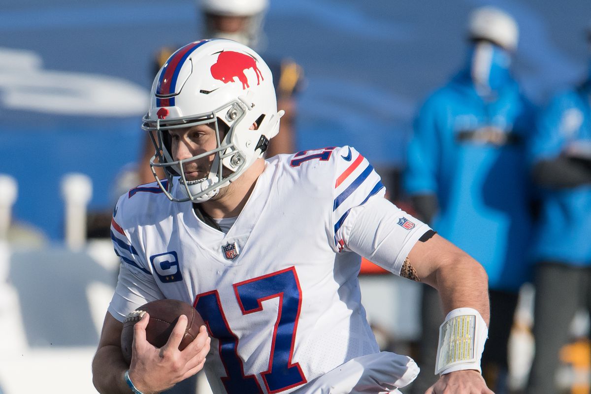 Buffalo Bills quarterback Josh Allen runs for a first down in the second quarter at Bills Stadium.