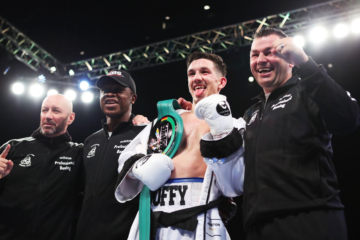 Liam Davies celebrates victory with his team after the WBC International Silver Super-Bantamweight title fight between Liam Davies and Dixon Flores at Utilita Arena Birmingham on October 09, 2021 in Birmingham, England.