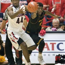 Arizona's Solomon Hill (44) and Arizona's State's Carrick Felix (0) vie for a loose ball during the second half of an NCAA college basketball game at McKale Center in Tucson, Ariz., Saturday, March 9, 2013. Arizona won 73-58.