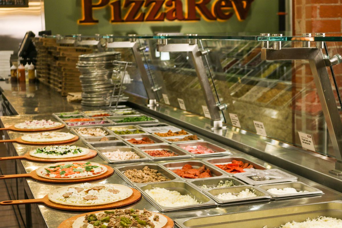 A PizzaRev topping line