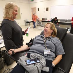 Vickie Bracken, information specialist for the Unified Police Department, right, and her friend, Elaina Carlston, laugh during an American Red Cross blood drive at the Salt Lake County Jail in South Salt Lake on Monday, Sept. 30, 2019. The Salt Lake County Sheriff’s Office and the Unified Police Department teamed with the American Red Cross for the event.