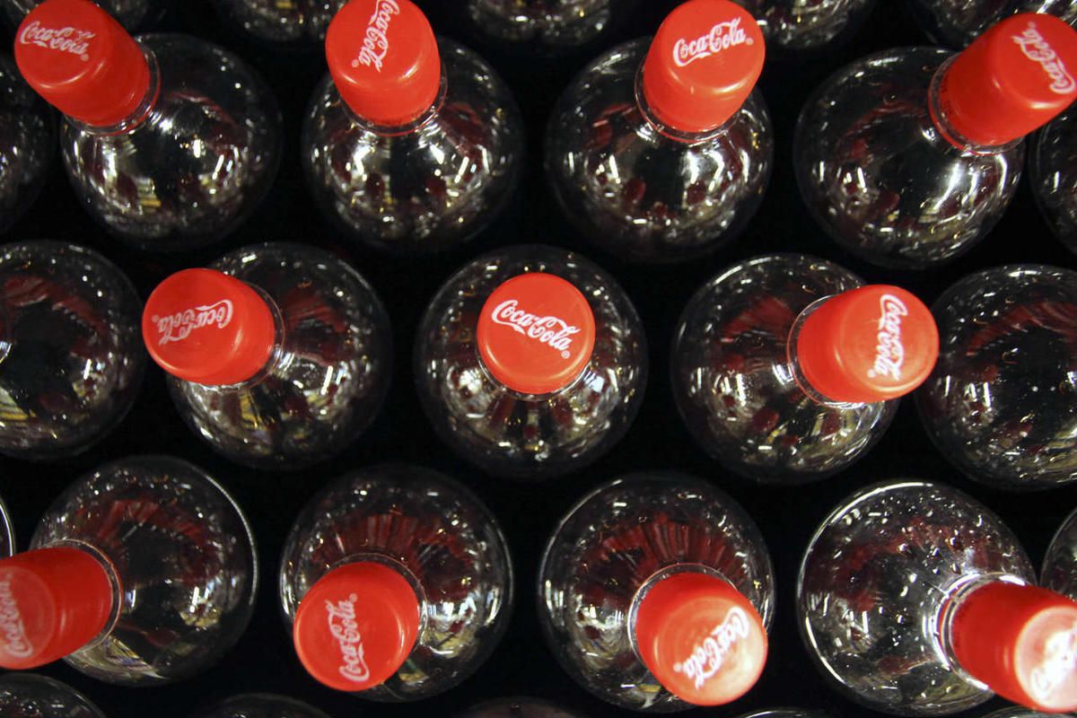 In this file photo made May 11, 2009, Coca-Cola bottles are shown at Carrefour supermarket in Paris. 