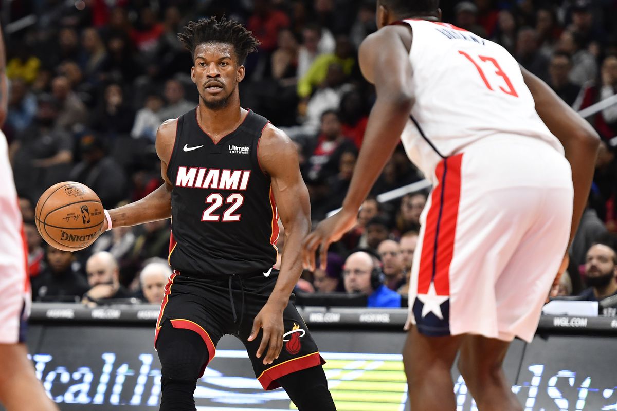 Miami Heat forward Jimmy Butler dribbles the ball as Washington Wizards center Thomas Bryant defends during the first quarter at Capital One Arena.