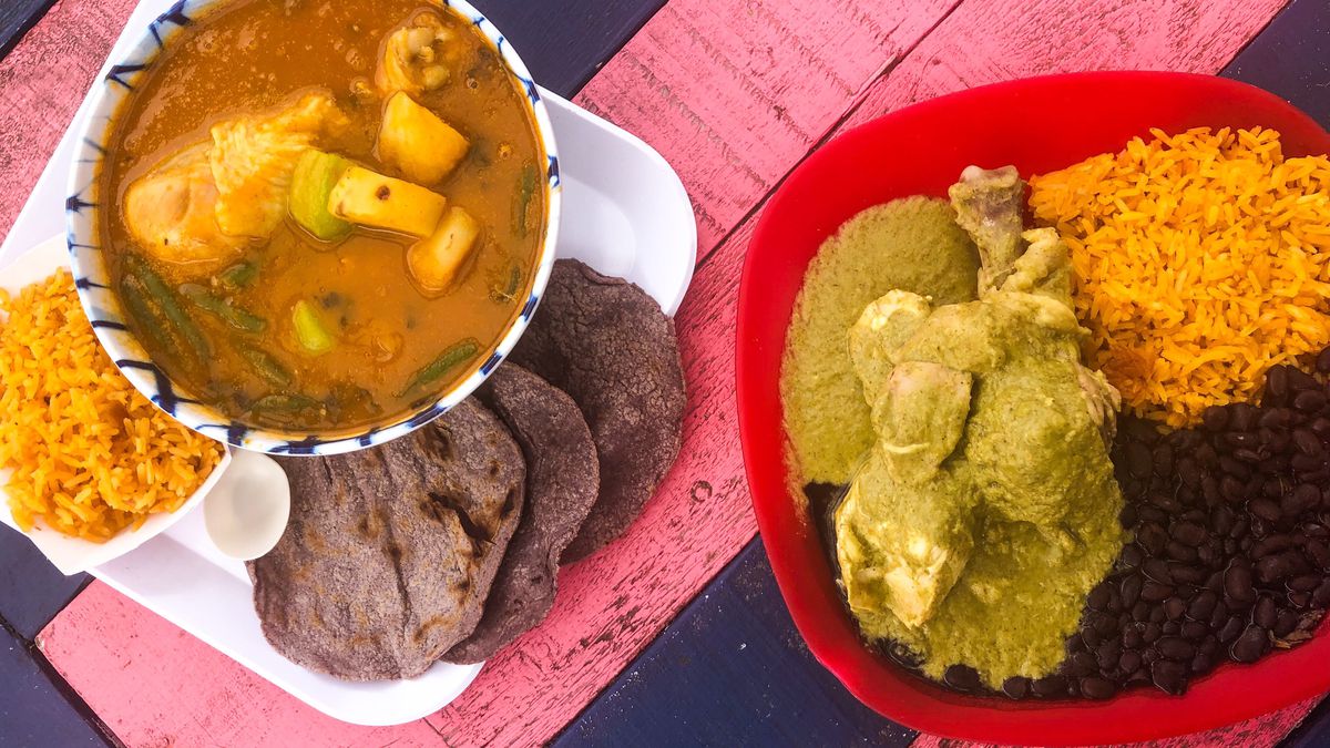 An overhead picture of Tierra del Sol’s mole amarillo on the left and mole verde on the right