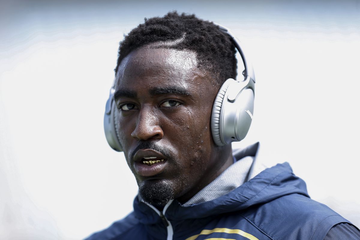 Kayvon Webster of the Los Angeles Rams with a pair of BOSE headphones on as he warms up before a game