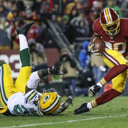 Washington Redskins wide receiver Jamison Crowder (80) heads toward the end zone for a touchdown after breaking a tackle by Green Bay Packers cornerback Quinten Rollins (24) during the second half of an NFL football game in Landover, Md., Sunday, Nov. 20, 2016. 