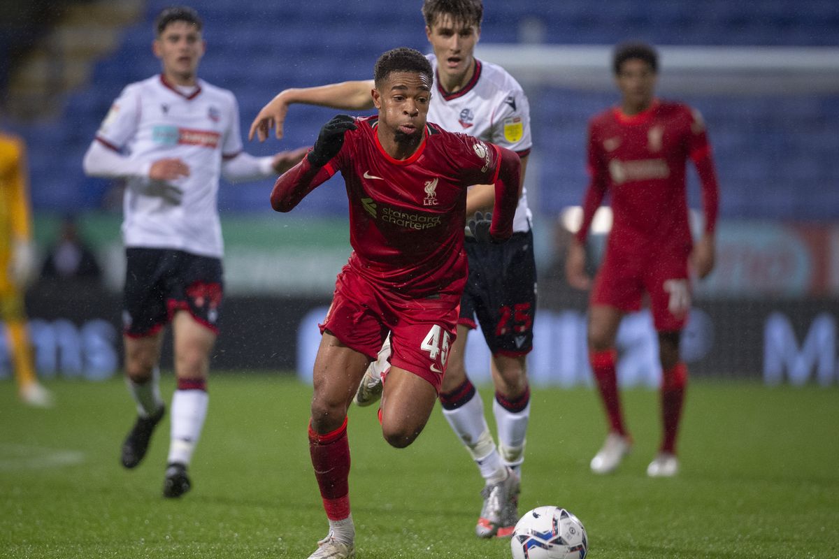 Elijah Dixon Bonner of Liverpool and George Thomason of Bolton Wanderers in action with Jarrell Quansah of Liverpool and Arran Pettifer of Bolton Wanderers during the Papa John’s EFL Trophy Northern Group D match between Bolton Wanderers and Liverpool U21’s at University of Bolton Stadium on October 5, 2021 in Bolton, England.