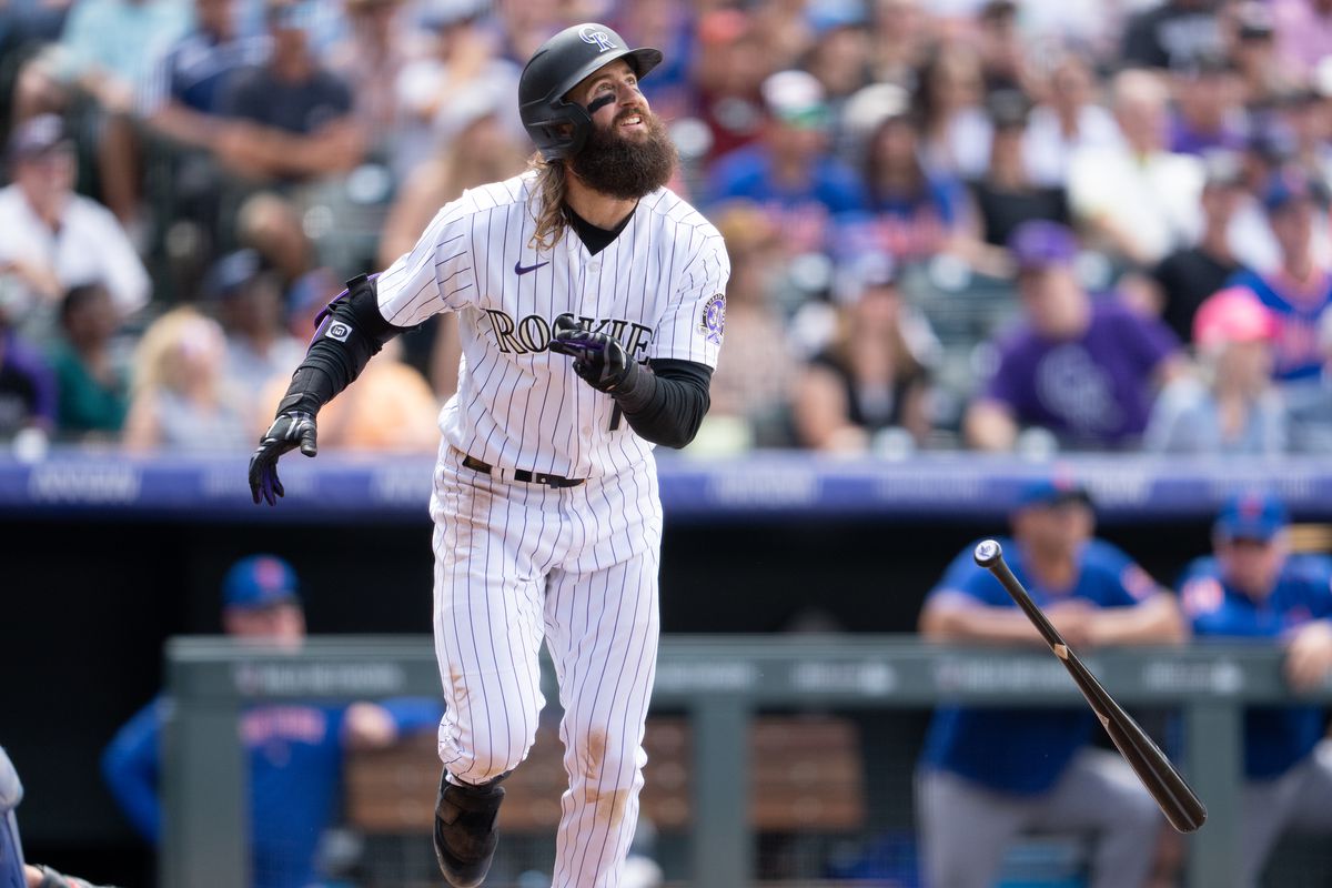 Charlie Blackmon #19 of the Colorado Rockies watches the flight of a home run against the New York Mets at Coors Field on May 28, 2023 in Denver, Colorado.