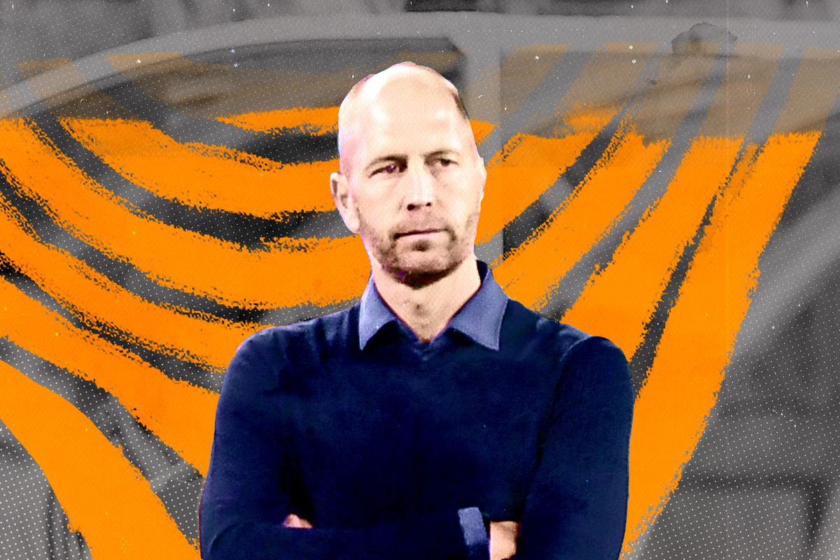 United States Men’s National Team head coach Gregg Berhalter standing with his arms folded on his chest in front of an orange illustrated background.
