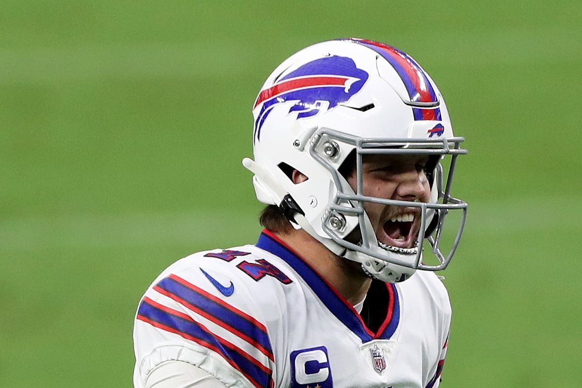 Josh Allen of the Buffalo Bills celebrates after Devin Singletary scored a two yard touchdown against the Las Vegas Raiders during the fourth quarter in the game at Allegiant Stadium on October 04, 2020 in Las Vegas, Nevada.