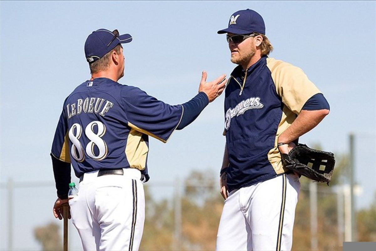 It's hard not to wonder if Corey Hart, seen here talking with coach Al Leboeuf, set himself up for a rough spring by overdoing it this offseason.