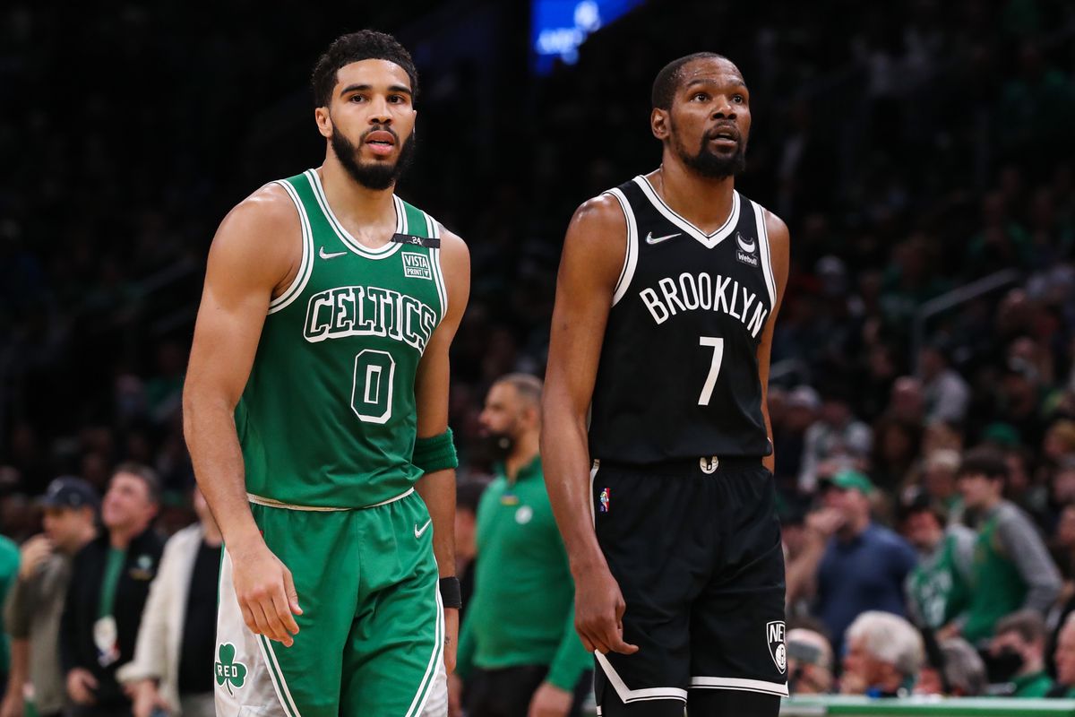 Boston Celtics forward Jayson Tatum (0) and Brooklyn Nets forward Kevin Durant (7) react during the first half at TD Garden.