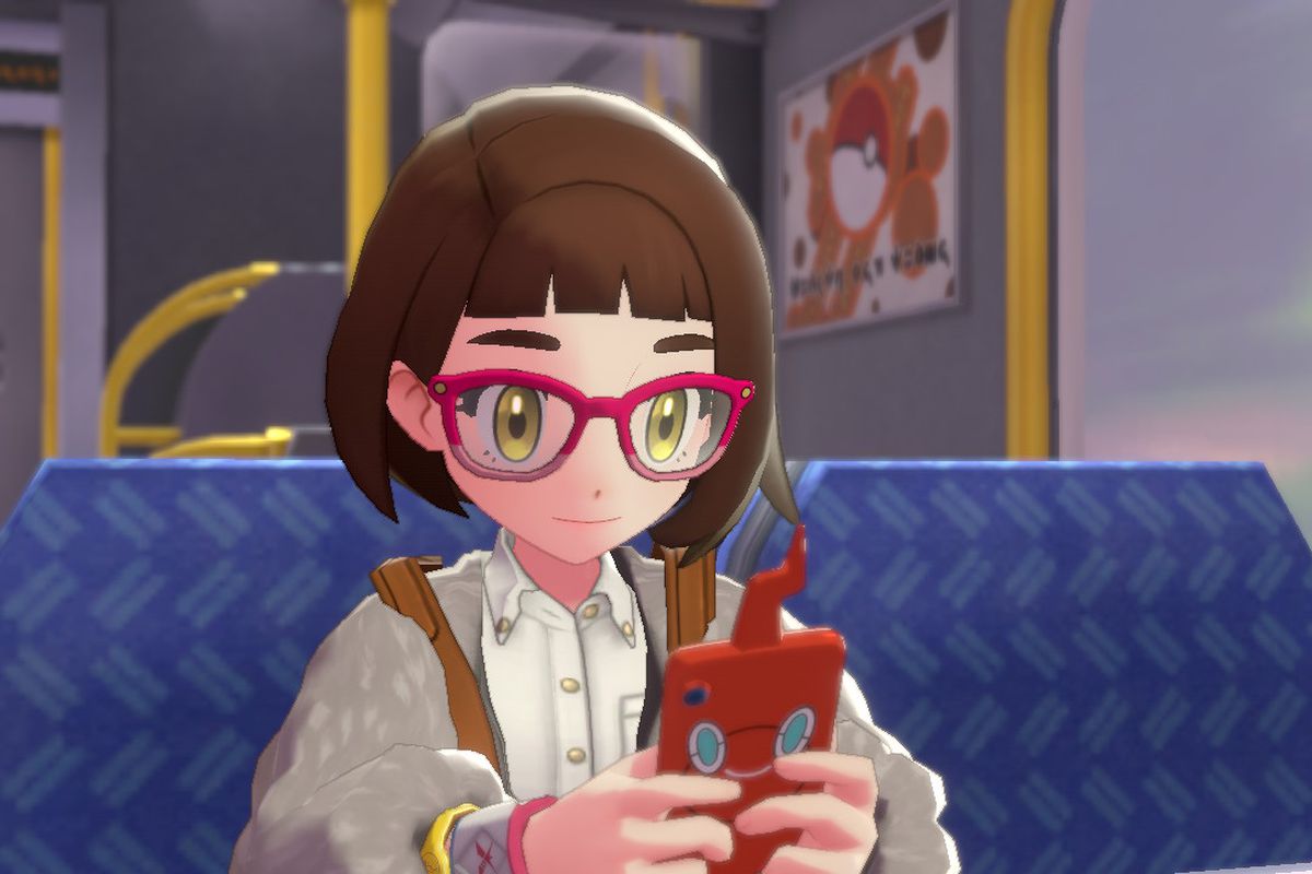 A pokemon trainer looking at a phone