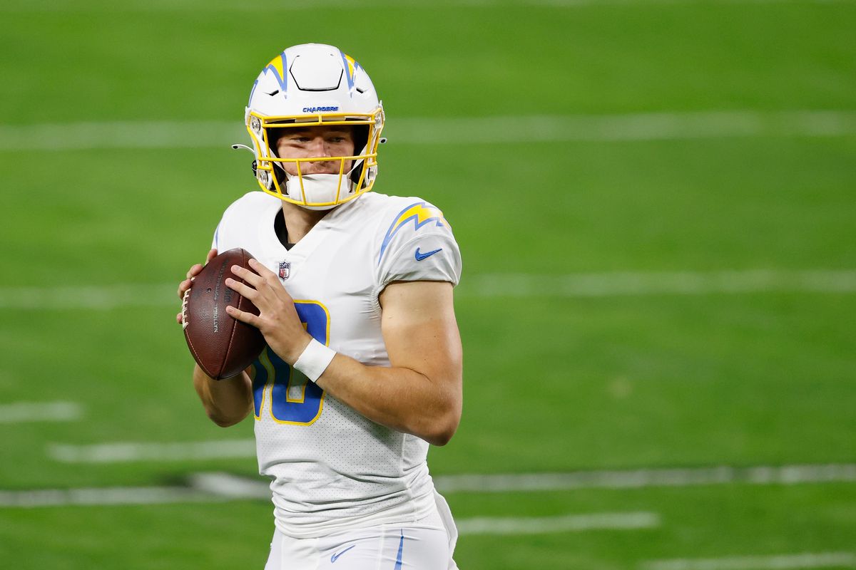 Quarterback Justin Herbert #10 of the Los Angeles Chargers warms up during the NFL game against the Las Vegas Raiders at Allegiant Stadium on December 17, 2020 in Las Vegas, Nevada. The Chargers defeated the Raiders in overtime 30-27.