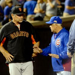 Bruce Bochy really is that much taller than Rick Renteria (Cubs VP of stadium ops Carl Rice at right)